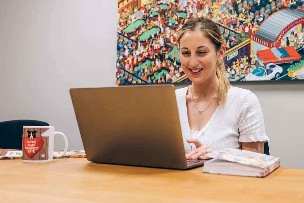 Young apprentice developing digital skills at work